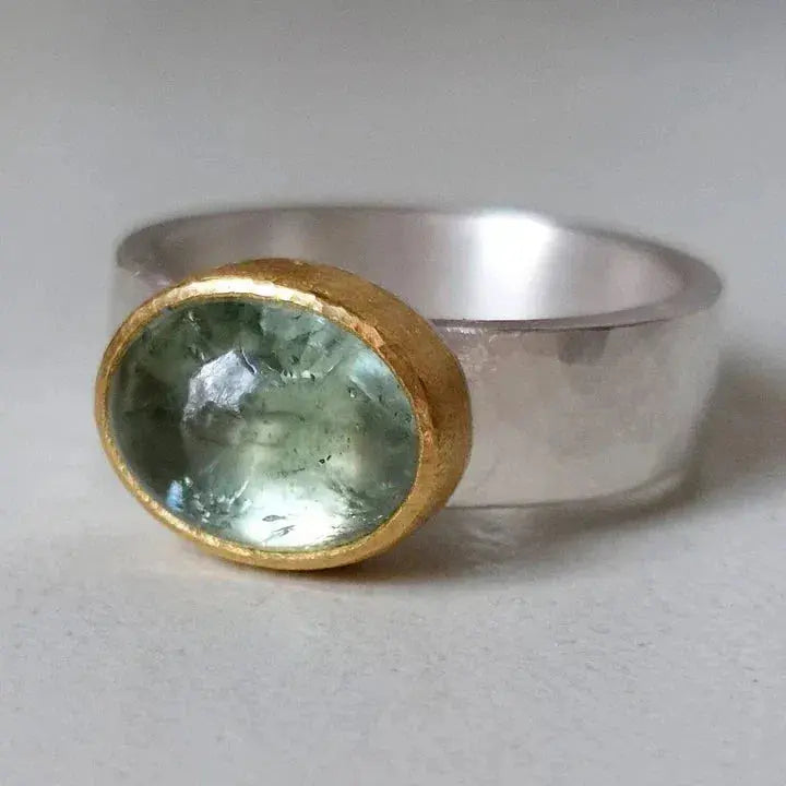 Green vintage ring with rounded stone